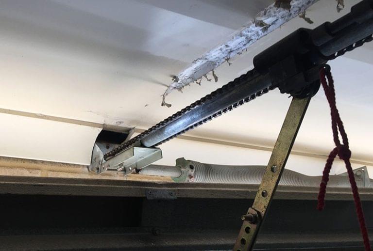 here are the causes of broken garage door spring