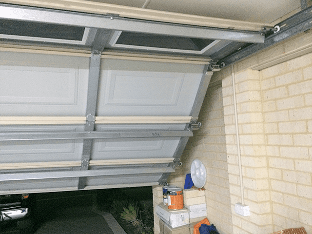 Broken Garage Door - Out of Tracks